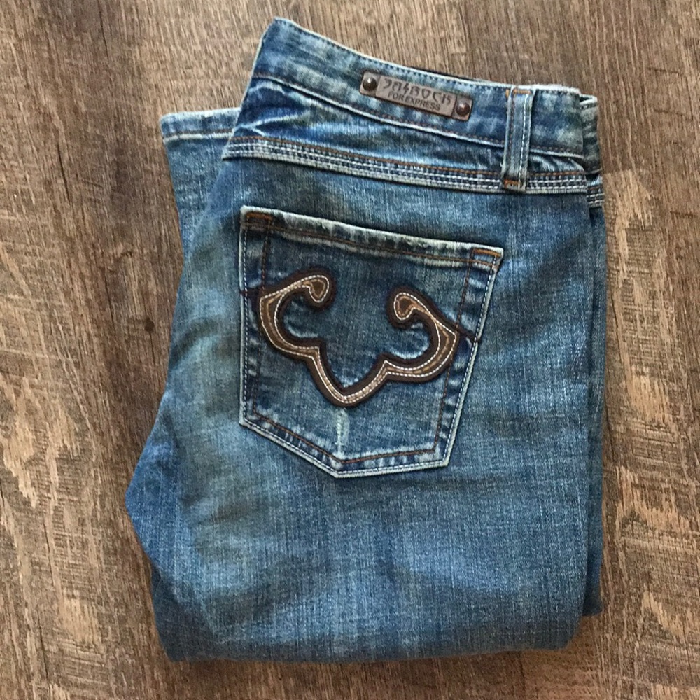 Rerock for express jeans with brown pocket detail.